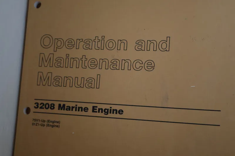Slide: The Image of Operation and Maintenance Manual for the 3208 Marine Engine. - 33