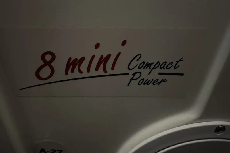 Slide: The Image of "8 mini Compact Power" text on 2023 Regal LS36 boat interior. - 16