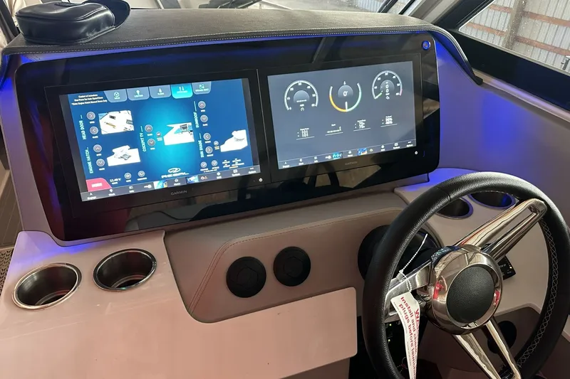 Slide: The Image of 2023 Regal LS36 dashboard with dual touchscreen displays and steering wheel. - 17