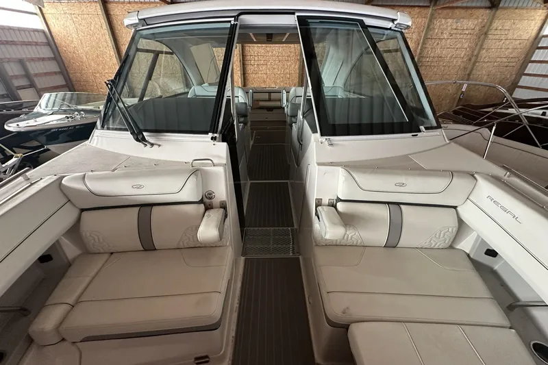 Slide: The Image of 2023 Regal LS36 boat interior with luxurious seating and modern design. - 22