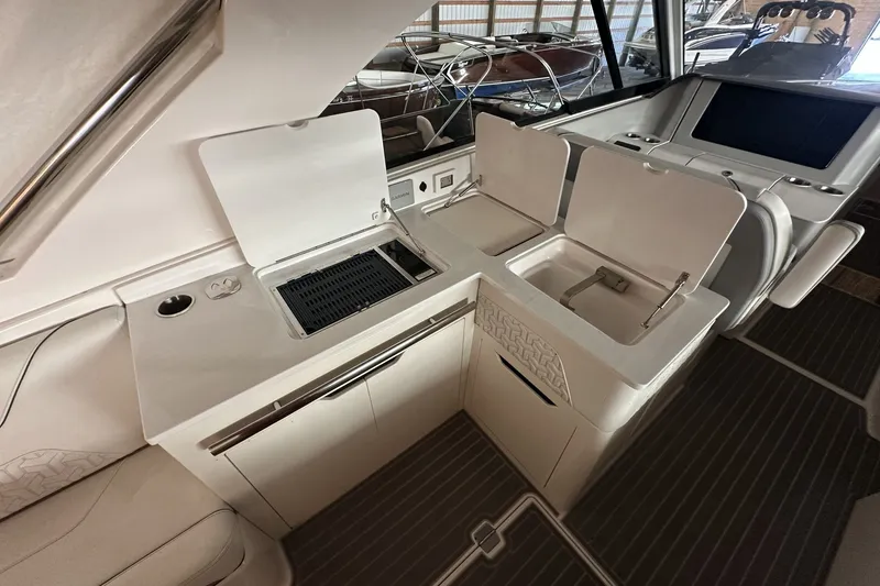 Slide: The Image of 2023 Regal LS36 yacht interior with kitchenette and modern amenities. - 10