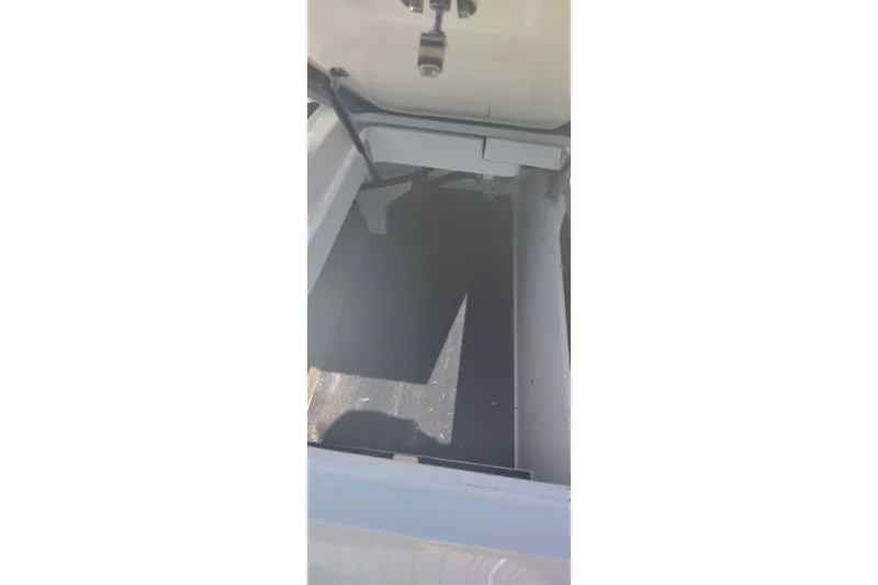 Slide: The Image of Storage compartment of 2023 Sea Ray SDX 270 boat, open and empty. - 40
