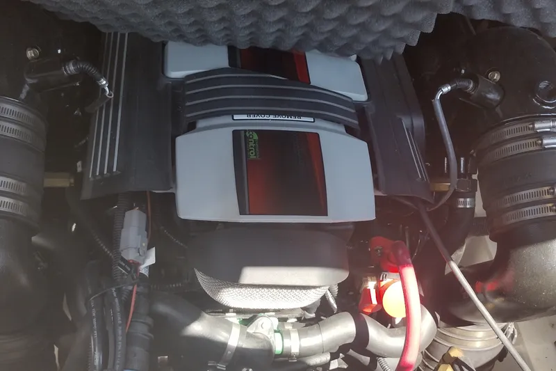 Slide: The Image of Engine compartment of 2023 Sea Ray SDX 270 boat, showcasing detailed mechanical components. - 39