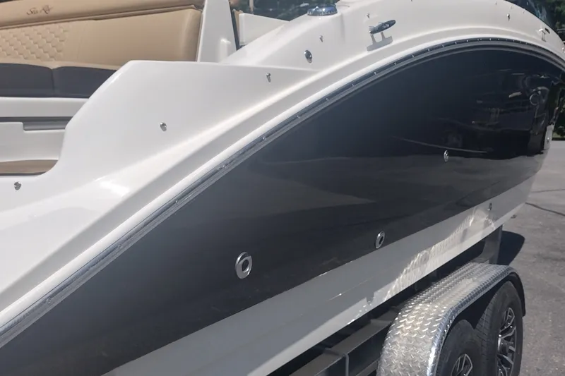 Slide: The Image of 2023 Sea Ray SDX 270 boat on trailer, showcasing sleek design and luxurious seating. - 10