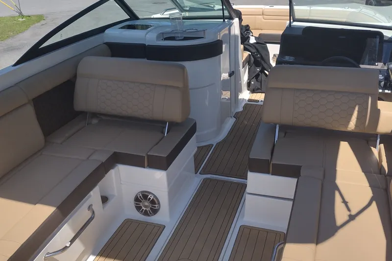 Slide: The Image of 2023 Sea Ray SDX 270 boat interior with tan seating and sleek design. - 53