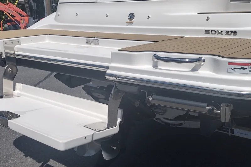 Slide: The Image of 2023 Sea Ray SDX 270 boat stern with swim platform and teak decking. - 11