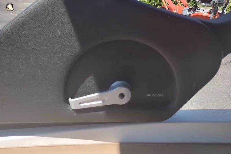 Slide: The Image of Locking mechanism on a 2023 Sea Ray SDX 270 boat door. - 29