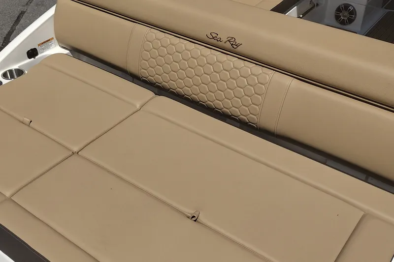 Slide: The Image of 2023 Sea Ray SDX 270 boat with tan leather seating and hexagonal stitching design. - 13