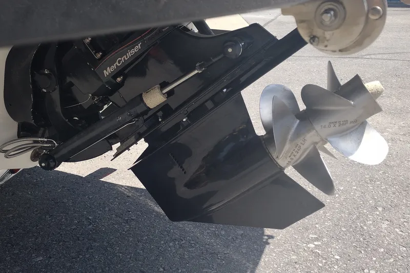 Slide: The Image of Close-up of a 2023 Sea Ray SDX 270 boat's MerCruiser propeller and drive system. - 8