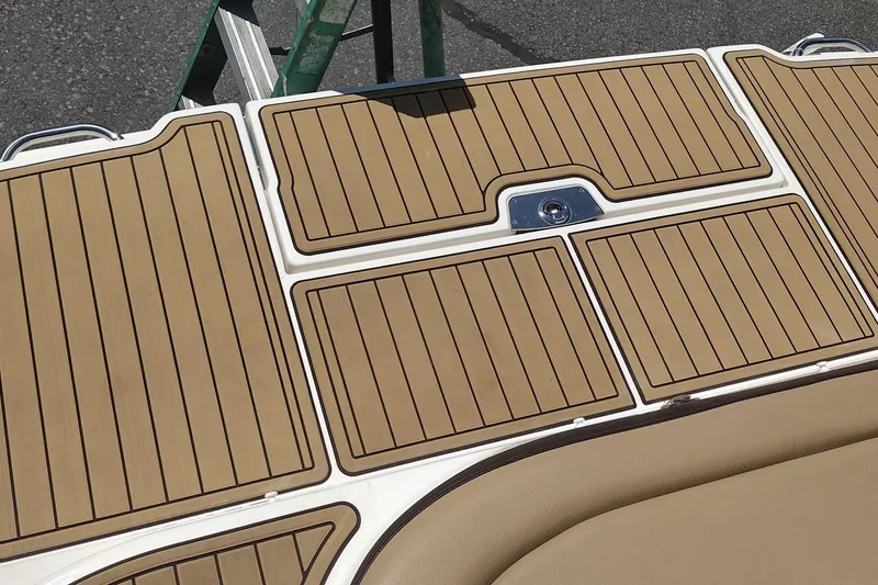 Slide: The Image of 2023 Sea Ray SDX 270 swim platform with tan marine decking. - 57