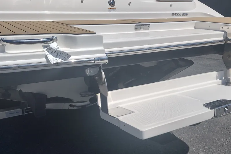 Slide: The Image of 2023 Sea Ray SDX 270 boat stern with swim platform and teak decking. - 12