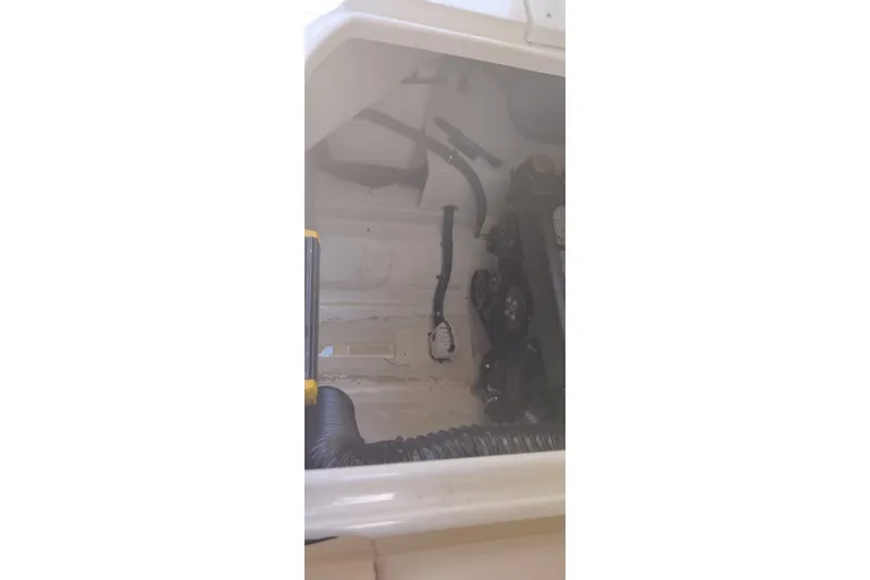 Slide: The Image of Engine compartment of 2023 Sea Ray SDX 270 boat, showcasing mechanical components. - 36