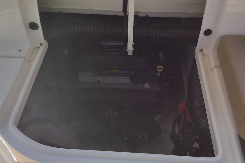Slide: The Image of Engine compartment of a 2023 Sea Ray SDX 270 boat, showcasing internal components. - 34