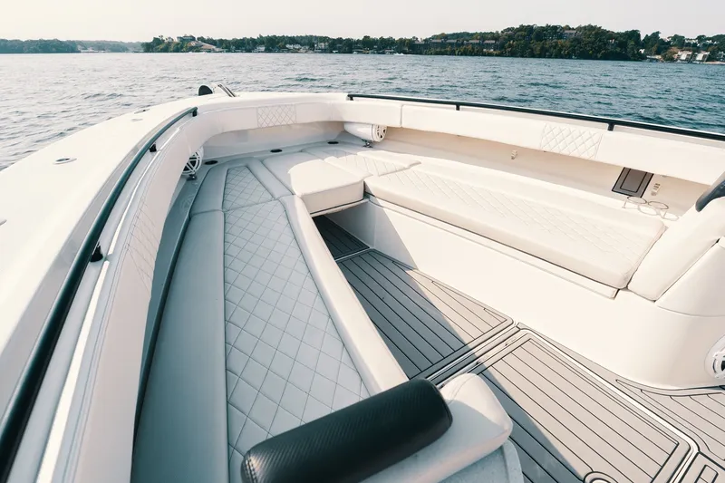 Slide: The Image of Luxurious seating area on a 2018 HCB 53 Suenos boat, with scenic water view. - 36