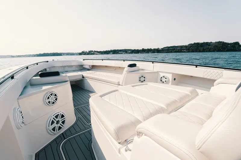 Slide: The Image of Luxurious 2018 HCB 53 Suenos boat interior with plush seating and scenic water view. - 39