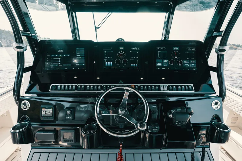Slide: The Image of Cockpit of 2018 HCB 53 Suenos boat with advanced navigation displays and controls. - 45