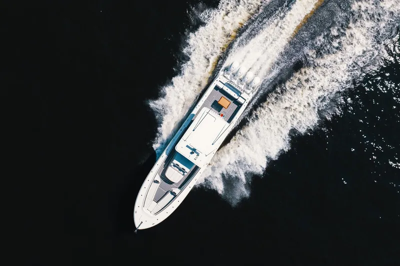 Slide: The Image of Aerial view of 2018 HCB 53 Suenos yacht cruising on open water. - 57