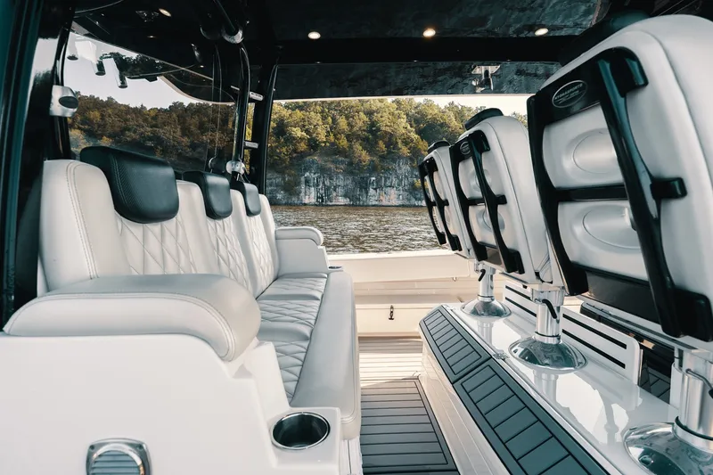 Slide: The Image of Luxurious interior of 2018 HCB 53 Suenos boat with plush seating and scenic water view. - 21