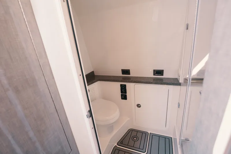 Slide: The Image of Bathroom interior of 2018 HCB 53 Suenos boat, featuring modern fixtures and sleek design. - 28