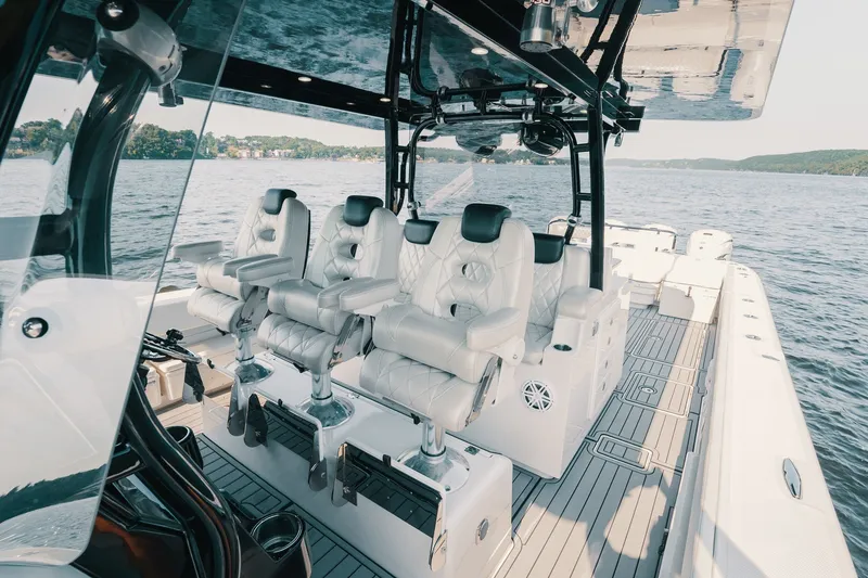 Slide: The Image of Luxurious interior of 2018 HCB 53 Suenos boat with plush seating on open water. - 50