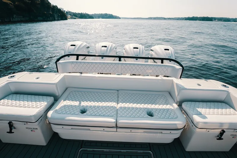 Slide: The Image of 2018 HCB 53 Suenos luxury boat with quad engines on a serene water backdrop. - 15