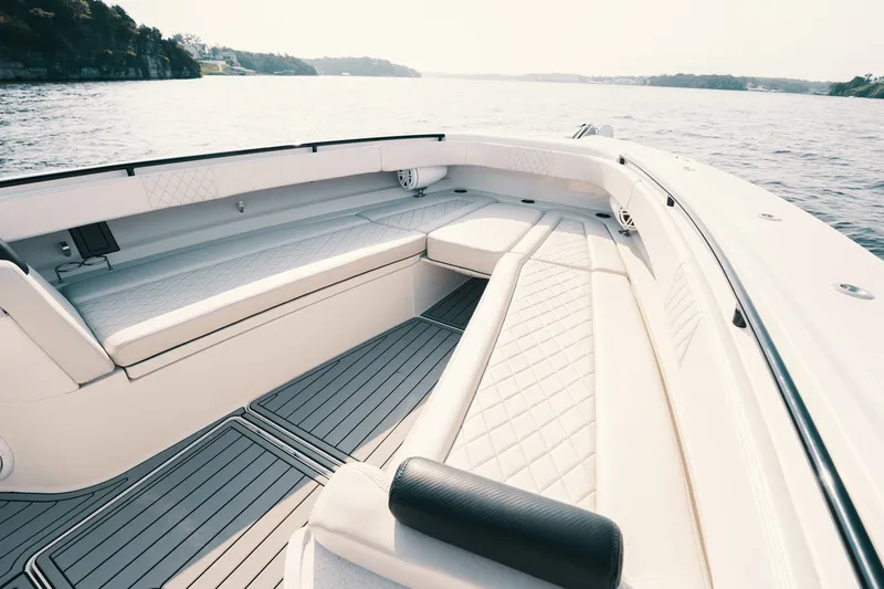 Slide: The Image of Luxurious seating area on 2018 HCB 53 Suenos boat, cruising on calm waters. - 37