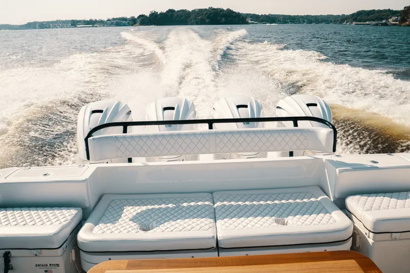 Slide: The Image of 2018 HCB 53 Suenos boat cruising on open water with powerful engines. - 14