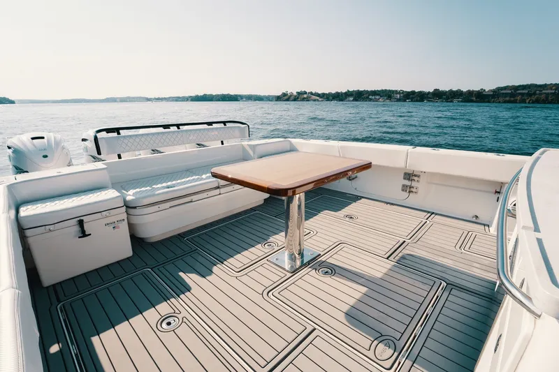 Slide: The Image of 2018 HCB 53 Suenos boat deck with seating and table on open water. - 17
