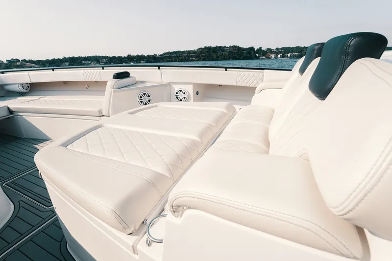 Slide: The Image of Luxurious seating on 2018 HCB 53 Suenos boat, featuring elegant white upholstery. - 38