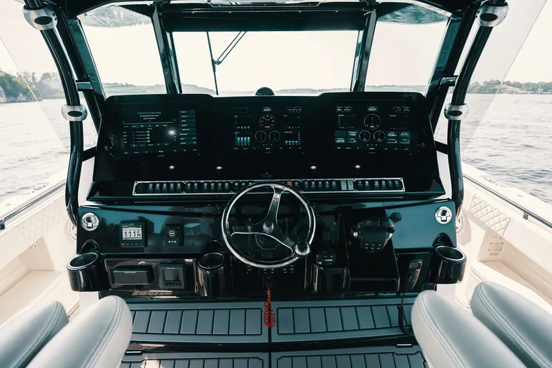 Slide: The Image of Helm of 2018 HCB 53 Suenos boat with advanced navigation displays and controls. - 44