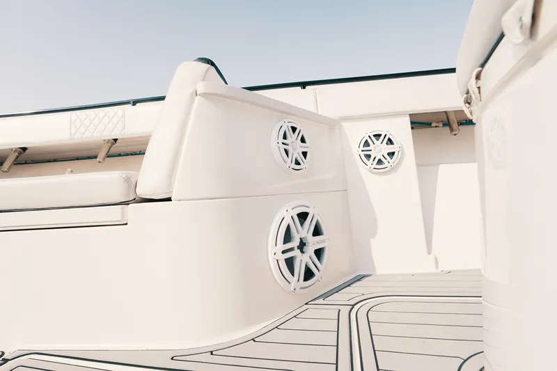 Slide: The Image of Interior view of 2018 HCB 53 Suenos boat, featuring sleek seating and built-in speakers. - 35