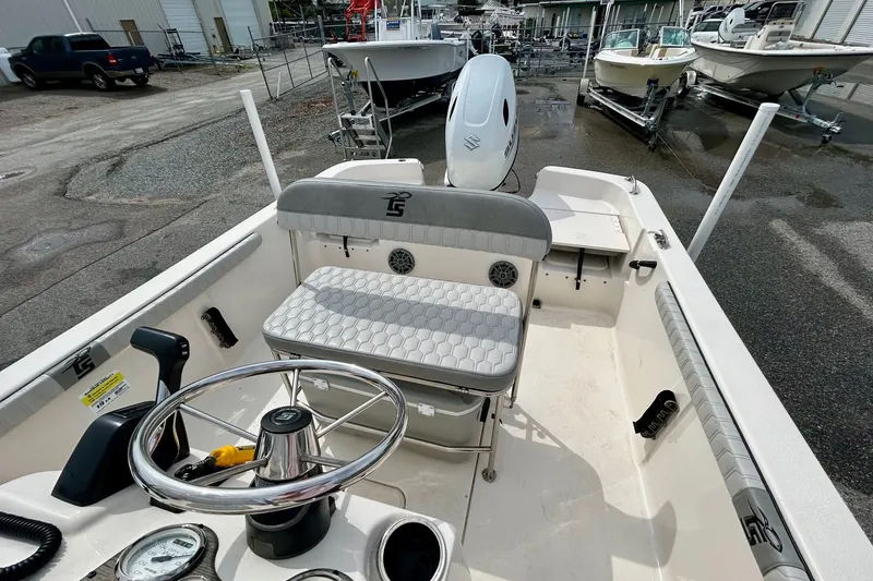 Slide: The Image of 2025 Carolina Skiff 19 LS boat interior with steering wheel and seating. - 7