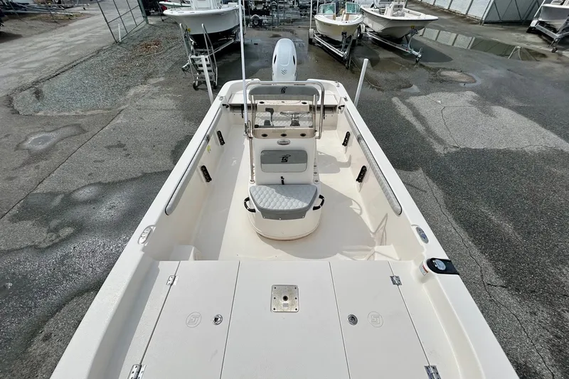 Slide: The Image of 2025 Carolina Skiff 19 LS boat interior, featuring spacious deck and seating. - 10
