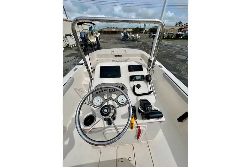 Slide: The Image of 2025 Carolina Skiff 19 LS boat dashboard with steering wheel and controls. - 6