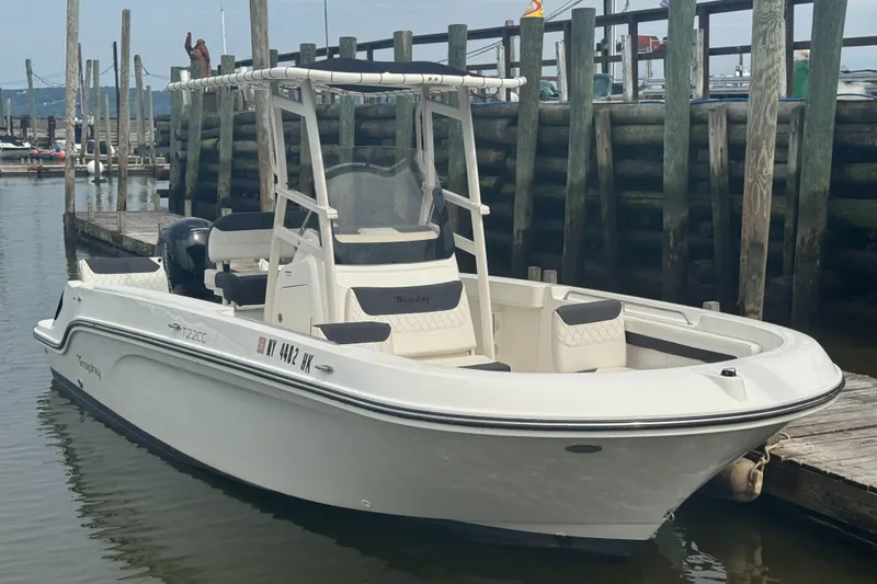 The Image of 2023 Trophy CC22 boat docked at a marina, featuring sleek design and modern amenities. - 1