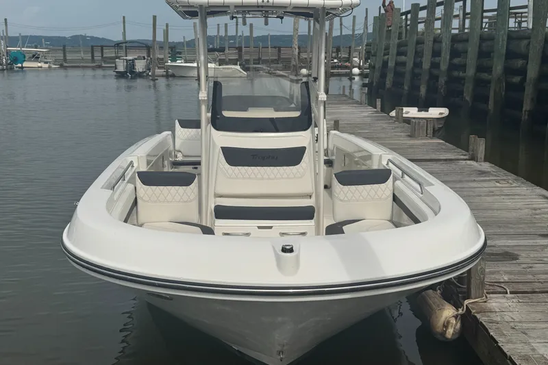 Slide: The Image of 2023 Trophy CC22 boat docked at a marina, showcasing sleek design and seating. - 3