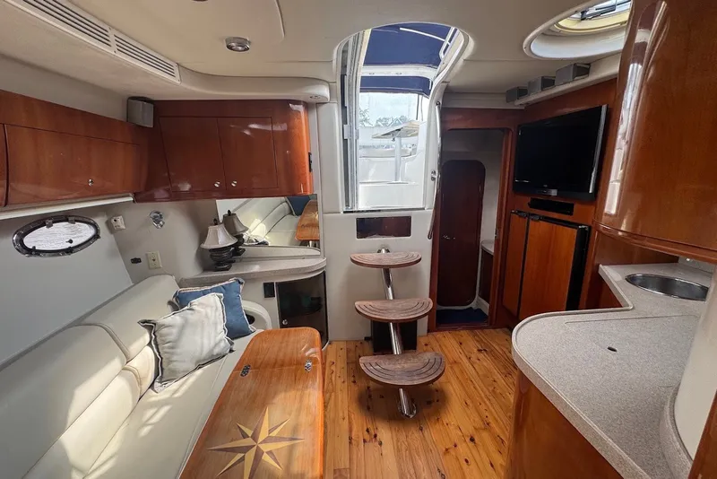 Slide: The Image of Luxurious interior of 2004 Regal Commodore 3860 yacht with wood finishes and modern amenities. - 14