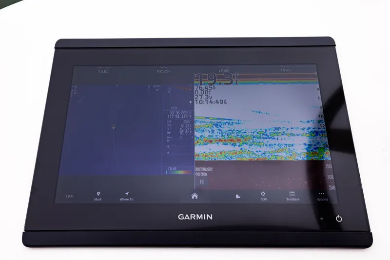 Slide: The Image of Garmin marine display on 2007 Cabo 31 Express, showing navigation and sonar data. - 11