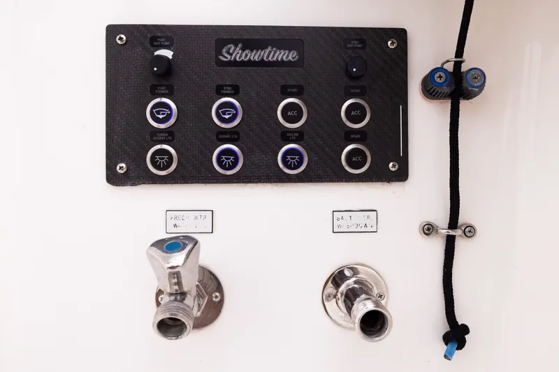 Slide: The Image of Control panel on a 2007 Cabo 31 Express boat with labeled switches and water outlets. - 9