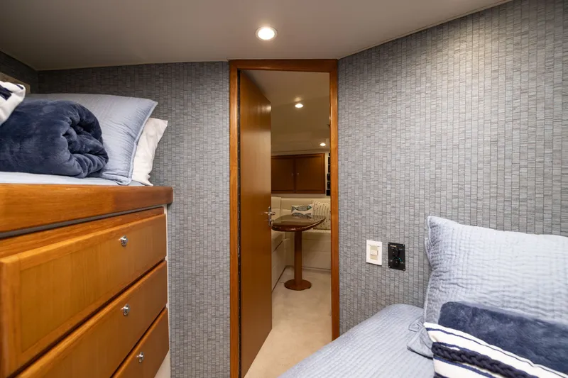 Slide: The Image of Interior of 2007 Cabo 31 Express boat with cozy cabin and wooden furnishings. - 40
