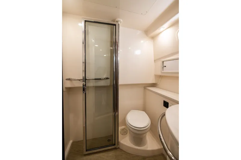 Slide: The Image of 2007 Cabo 31 Express yacht bathroom with shower, toilet, and modern fixtures. - 43