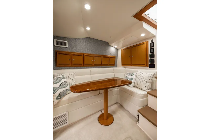 Slide: The Image of Luxurious interior of 2007 Cabo 31 Express yacht with elegant seating and wooden table. - 33