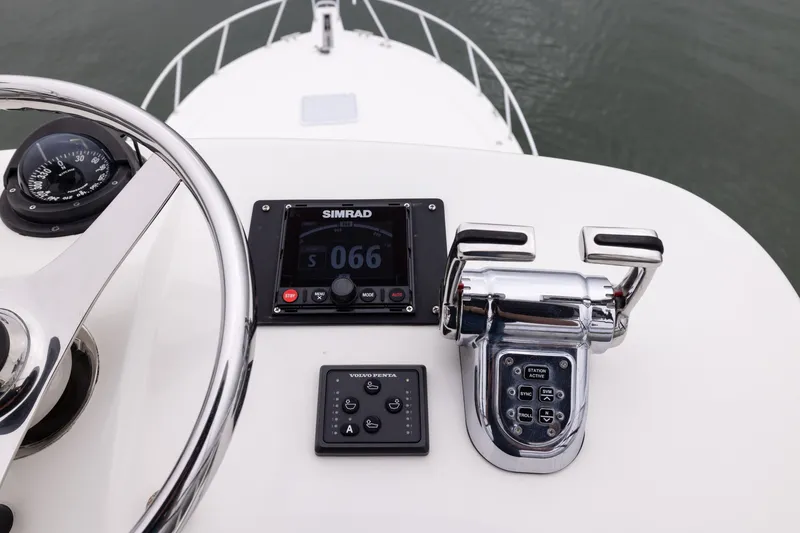 Slide: The Image of Helm of 2007 Cabo 31 Express boat with Simrad display and Volvo Penta controls. - 20