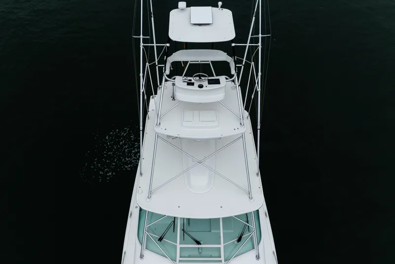 Slide: The Image of Aerial view of 2007 Cabo 31 Express boat on dark water. - 57
