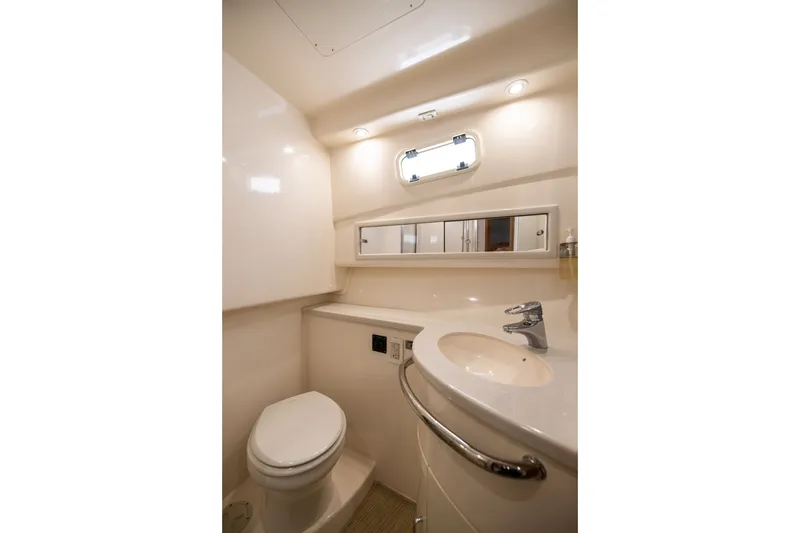 Slide: The Image of Luxurious bathroom interior of 2007 Cabo 31 Express yacht, featuring modern fixtures and elegant design. - 42