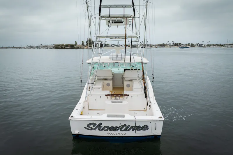 Slide: The Image of 2007 Cabo 31 Express boat named "Showtime" on calm waters, rear view. - 51