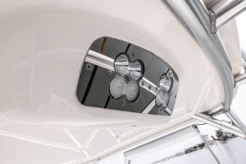 Slide: The Image of Close-up of 2007 Cabo 31 Express boat's stainless steel light fixtures. - 26