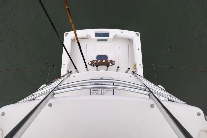Slide: The Image of Overhead view of 2007 Cabo 31 Express fishing boat deck with rods. - 24