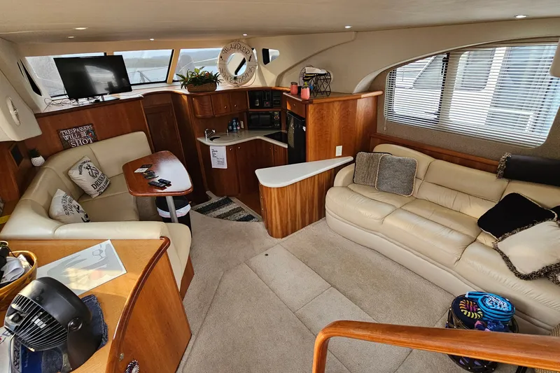 Slide: The Image of Luxurious interior of a 2003 Silverton 35 Motor Yacht with plush seating and modern amenities. - 16
