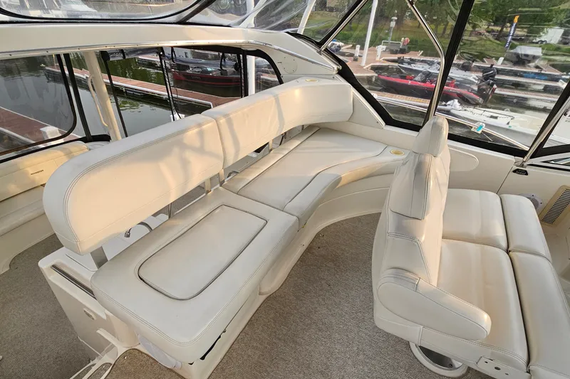 Slide: The Image of Luxurious interior of 2003 Silverton 35 Motor Yacht with plush seating and panoramic windows. - 12